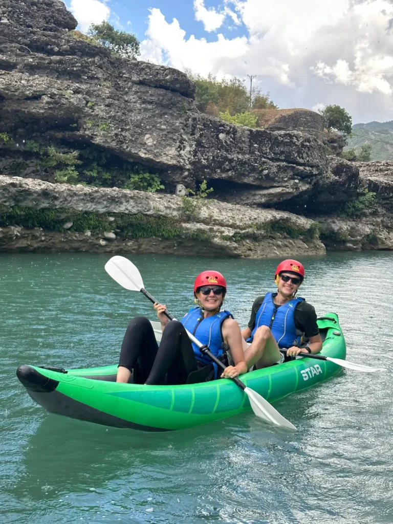 Kayaker paddling the turquoise Vjosa river near Përmet, Albania